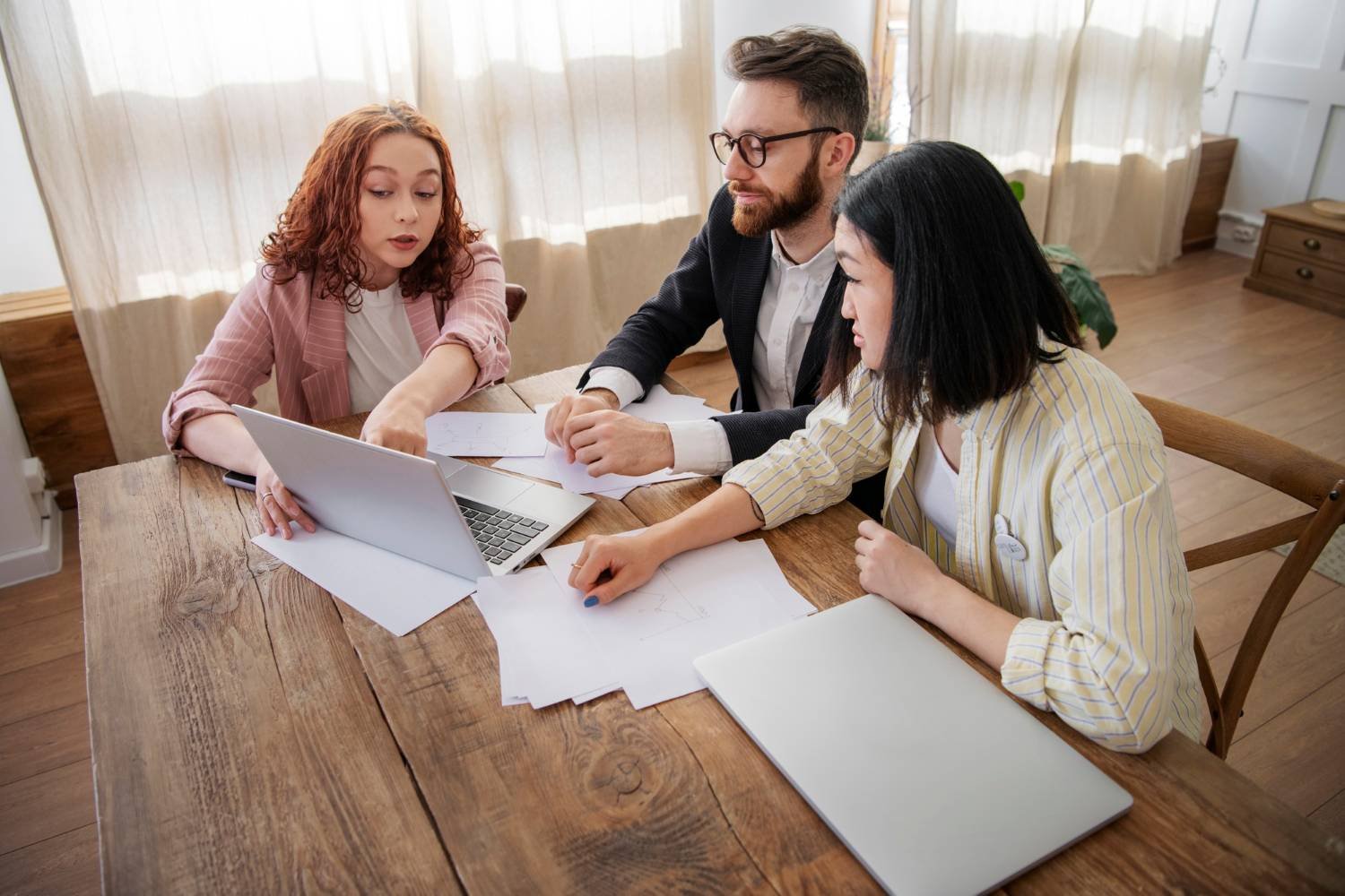people looking at laptop